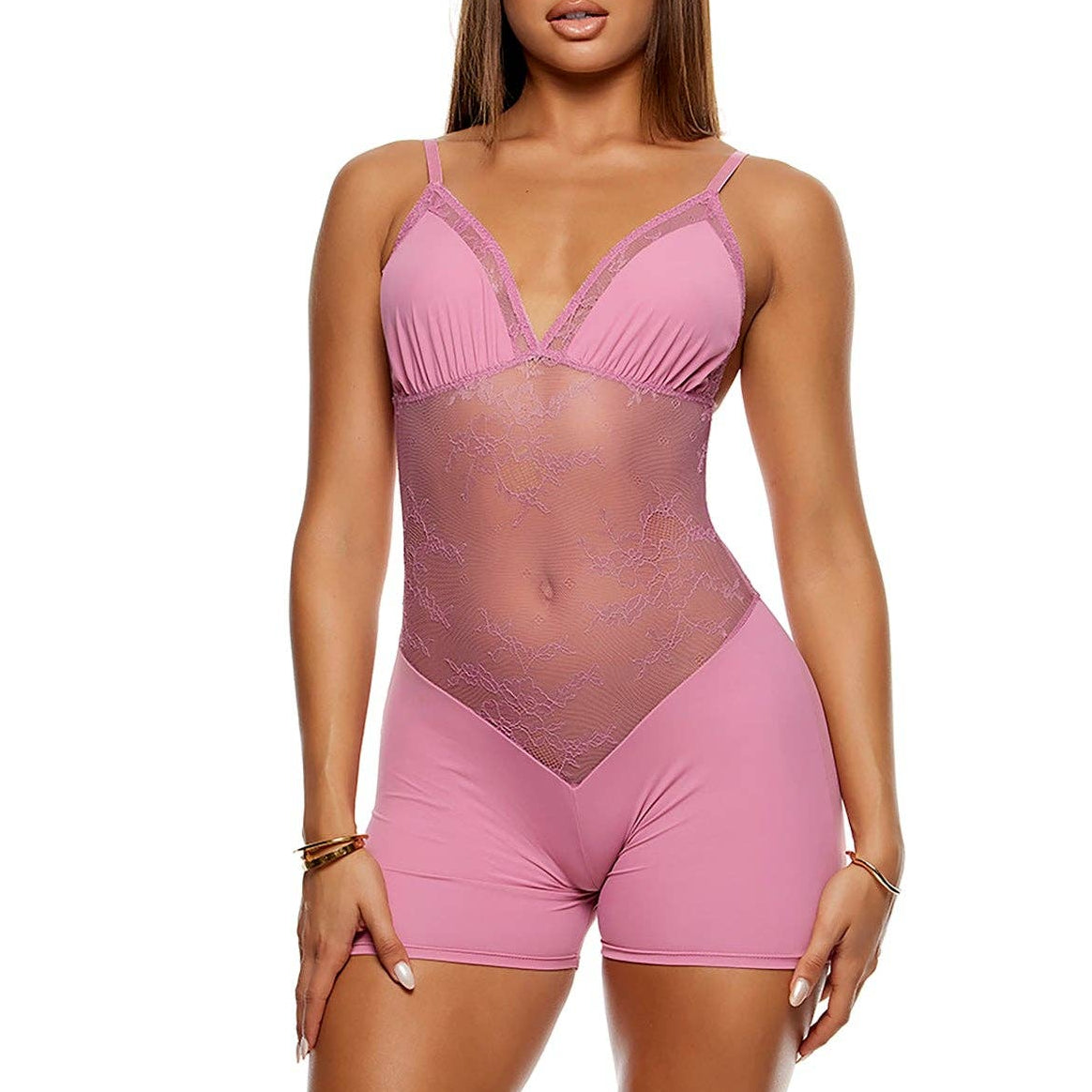 Woman wearing a pink bodysuit on a white background