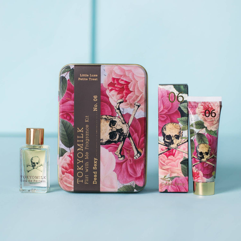 TOKYOMILK beauty products with floral design on a light blue background