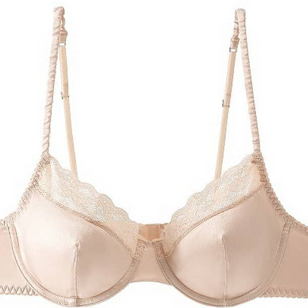 Beige bra and panties set on a white background