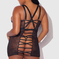 Person wearing a black lace lingerie set against a white background