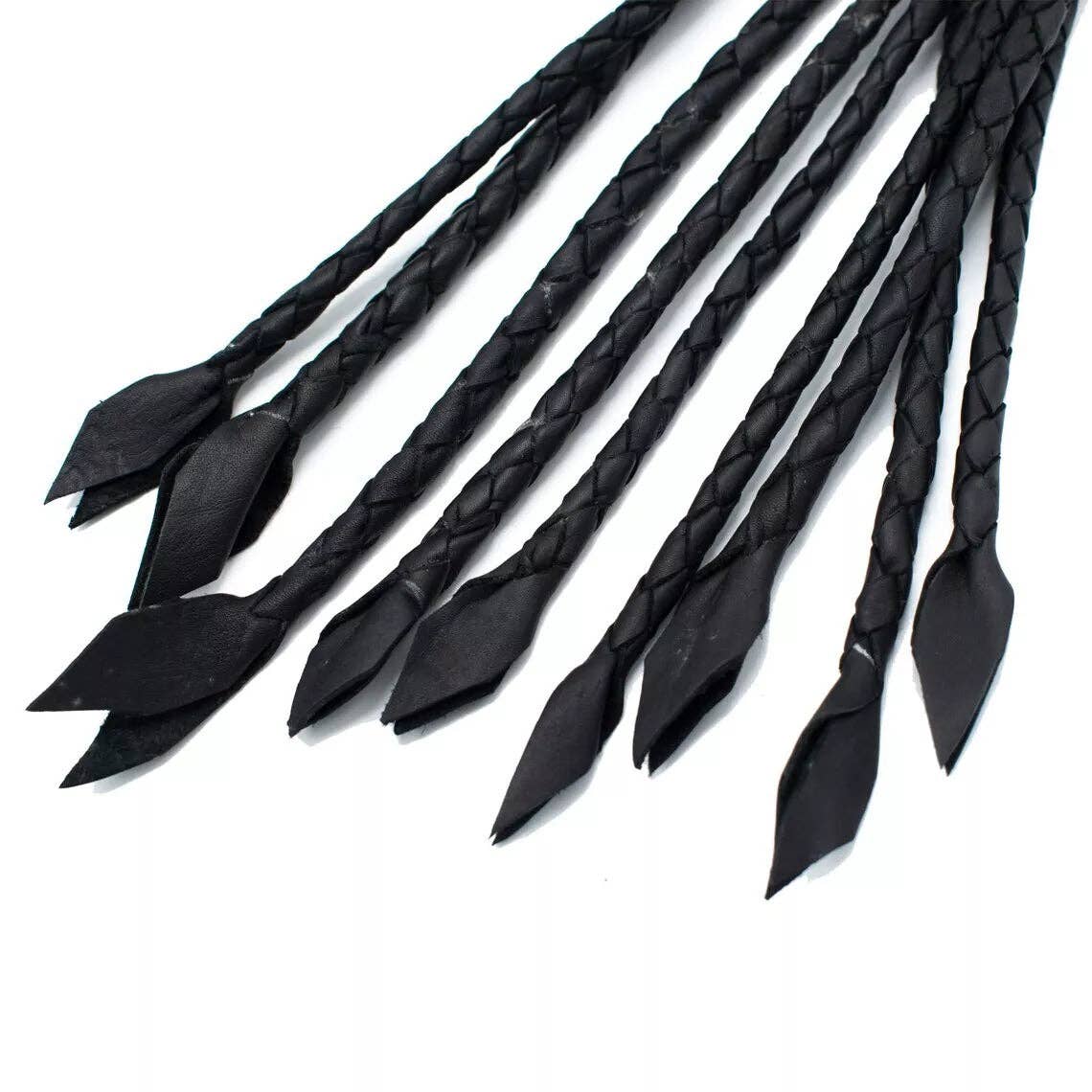 A set of black braided leather whip tails with pointed leaf-shaped ends, arranged on a plain white background.