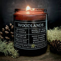 Woodlands candle with label on a dark background