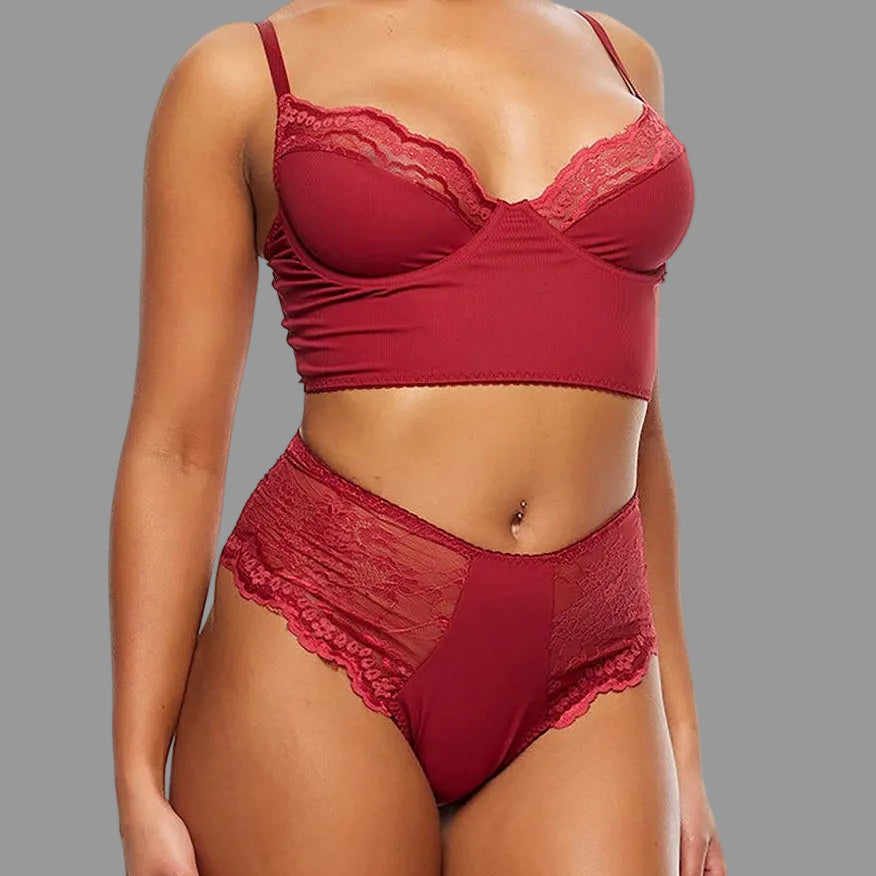 A woman modeling a two-piece lingerie set in a deep red color, featuring a lace-trimmed bralette and matching high-waisted briefs, against a plain white background.