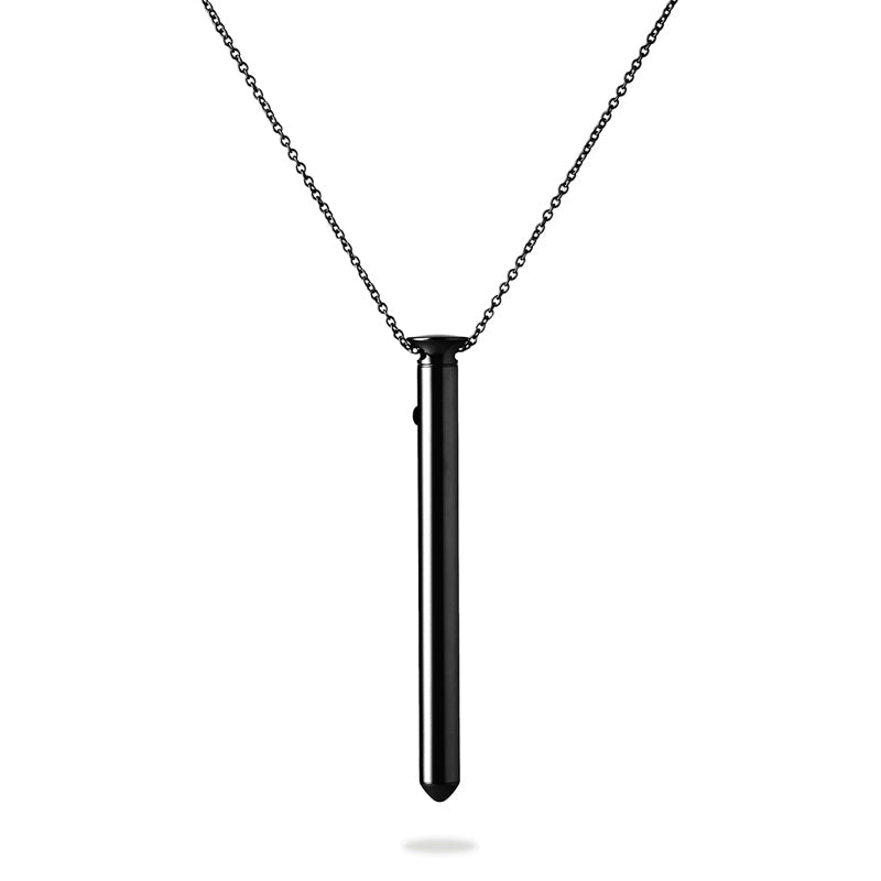 A very slim, smooth vibe, dangling from a matching chain.
