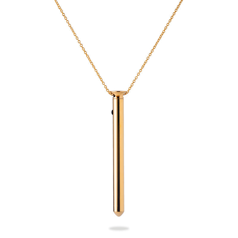A thin, elegant, metal vibe that hangs on a necklace chain.