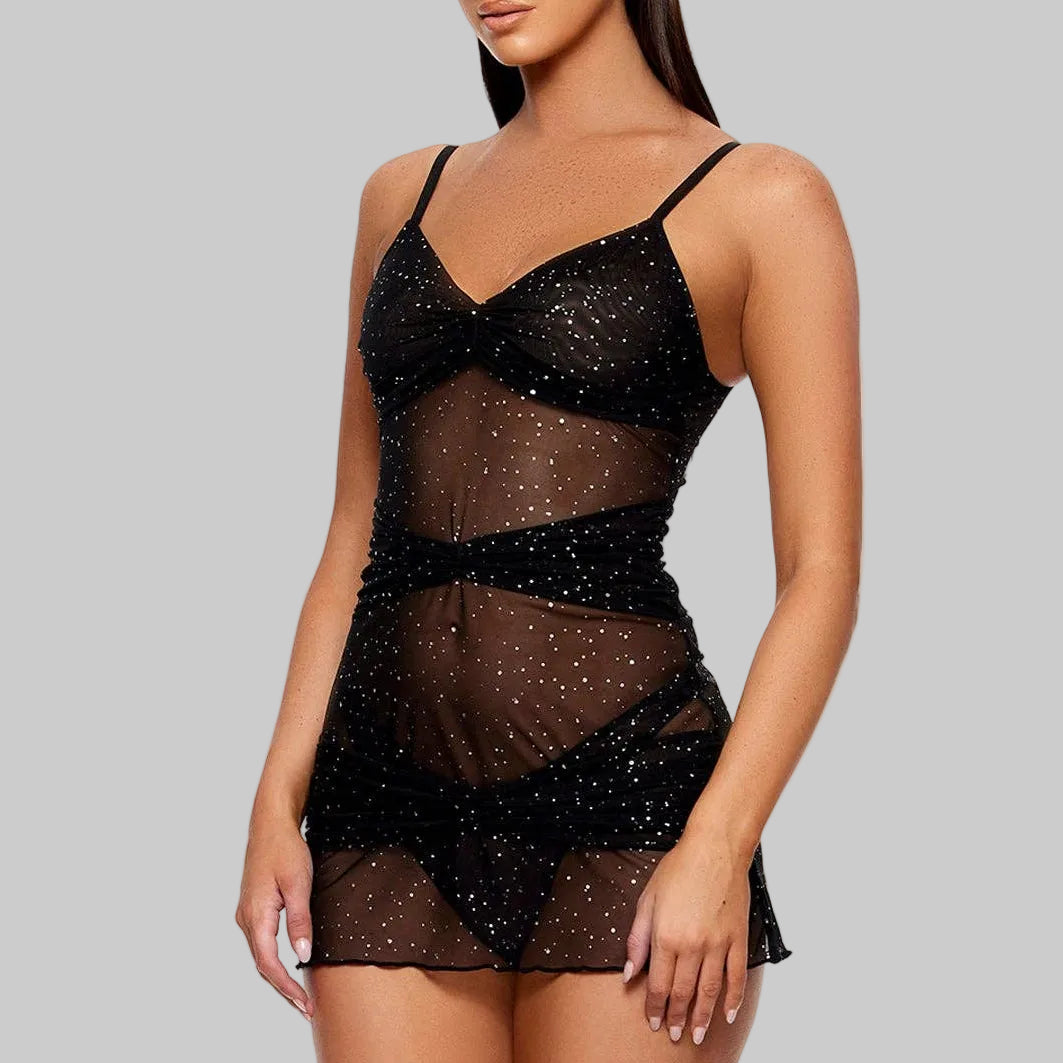 Woman wearing a black sheer nightgown on a white background