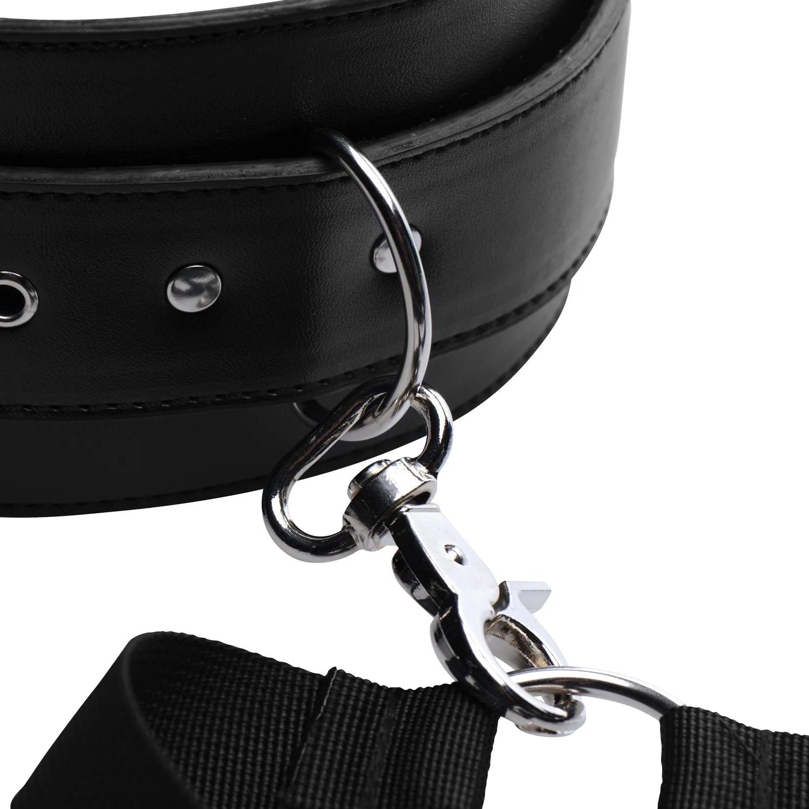 Black leather collar with metal clasp and attached cuff, showing the quality of the hardwear.
