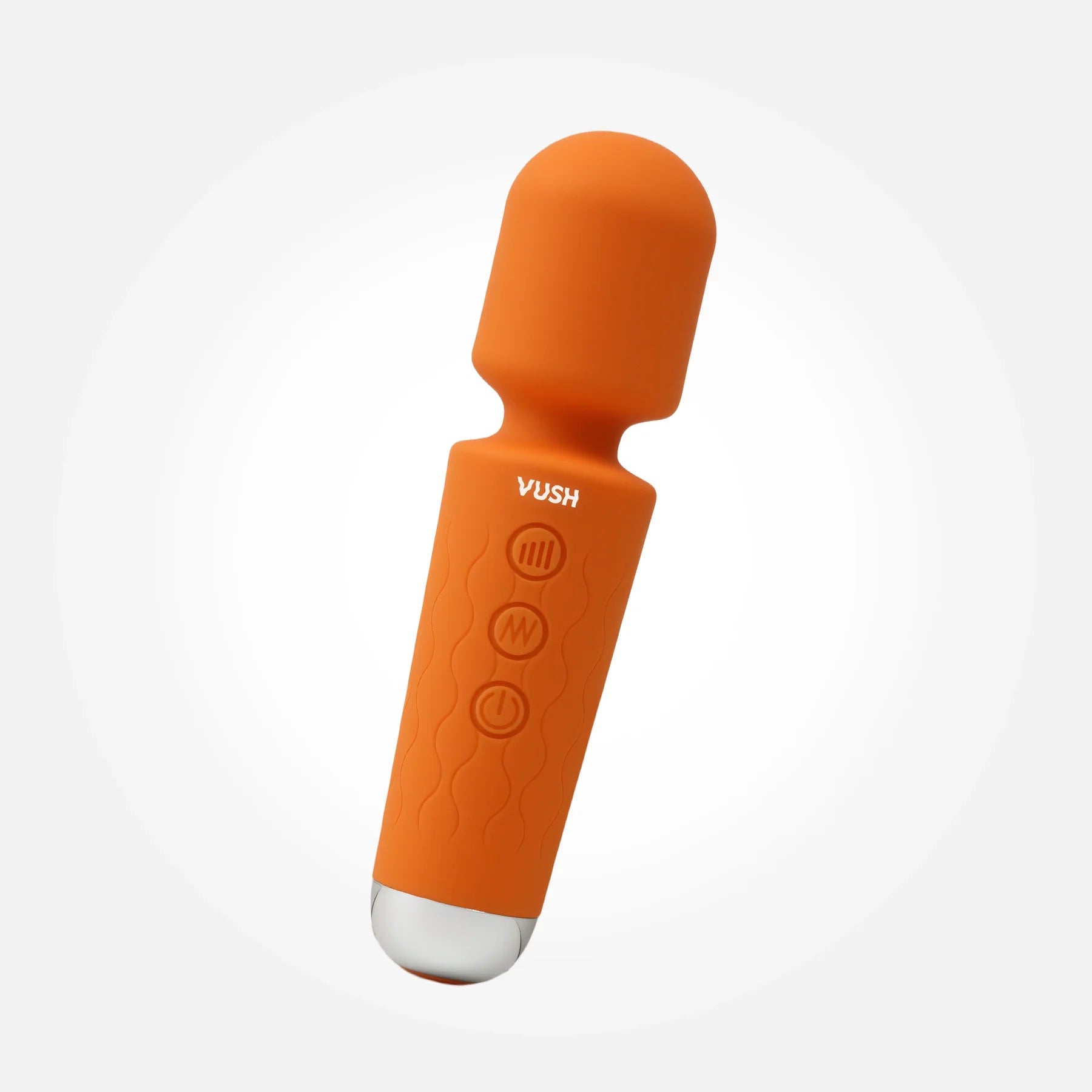Pumpkin orange petite massage wand with inset buttons and a metal base.