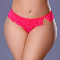 Person wearing a pink lace underwear set on a plain background