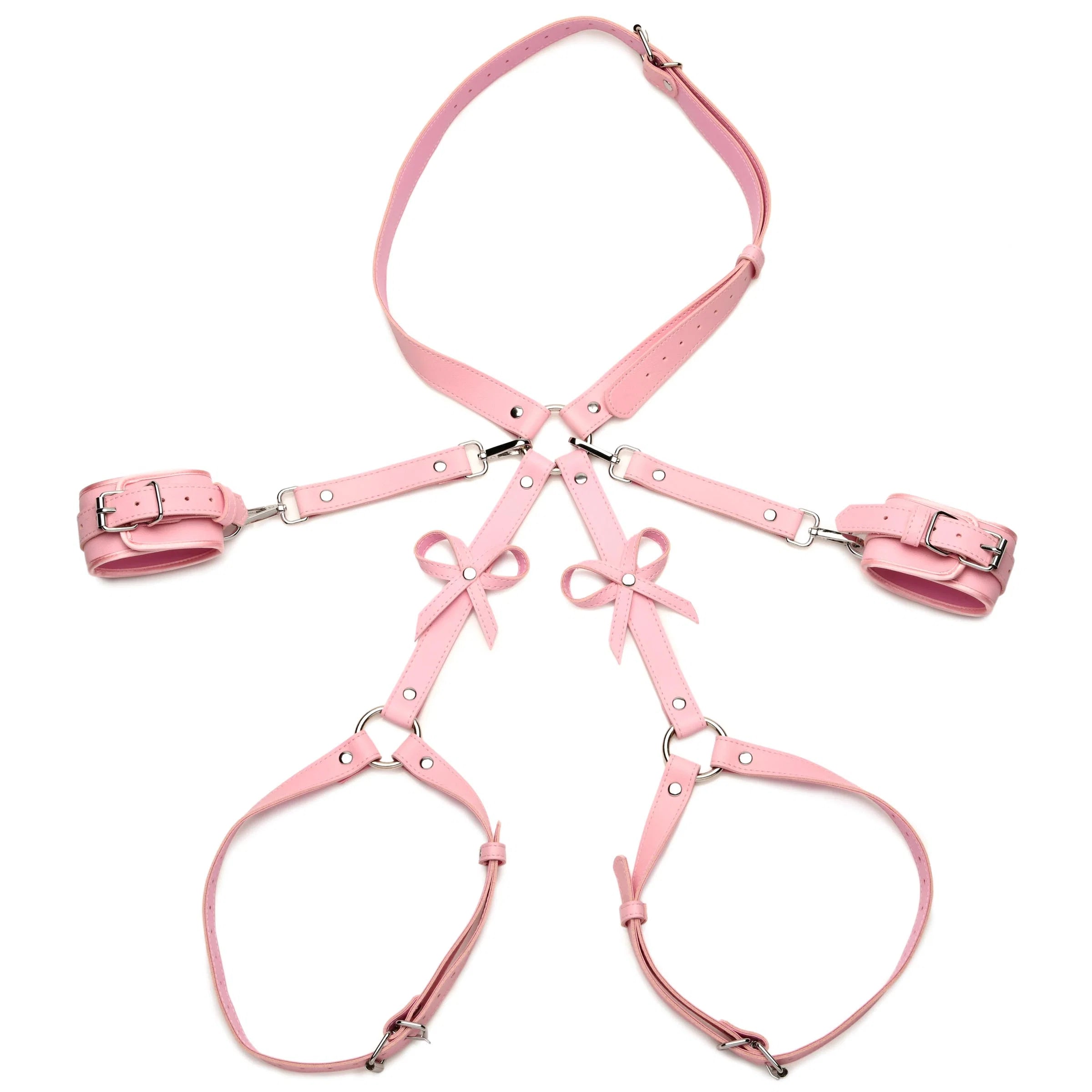 Pink faux leather harness set with matching wrist cuffs and thigh straps, featuring silver metal buckles and decorative bows, displayed on a solid white background.