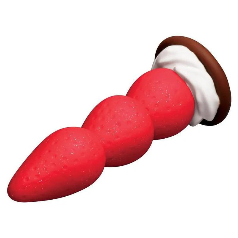 Red silicone plug with a white center and brown cap on a white background