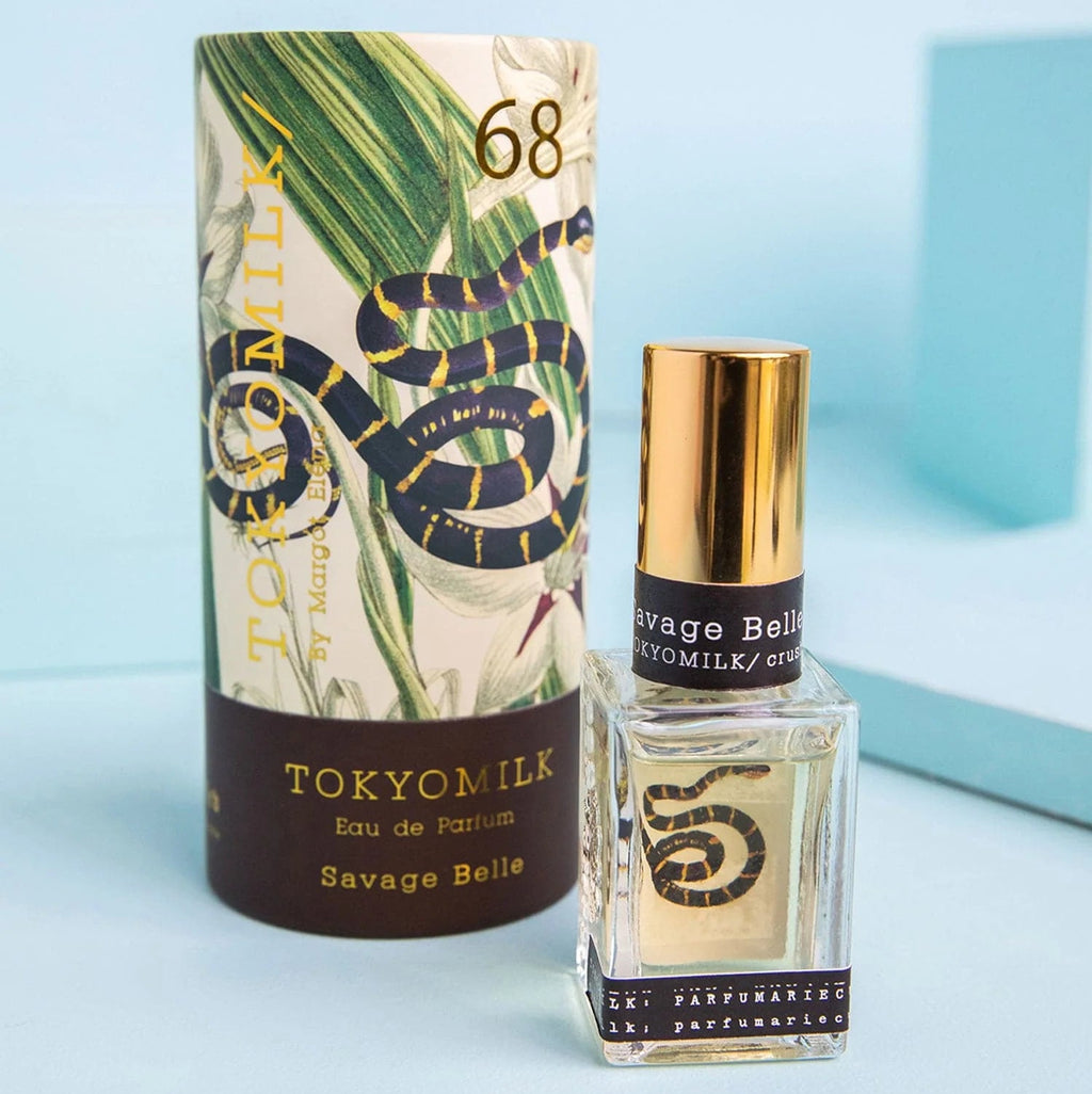Perfume bottle and packaging with 'Tokyo Milk' branding on a light blue background