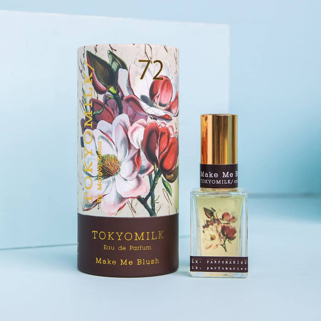 TOKYOMILK perfume bottle and packaging on a light blue background