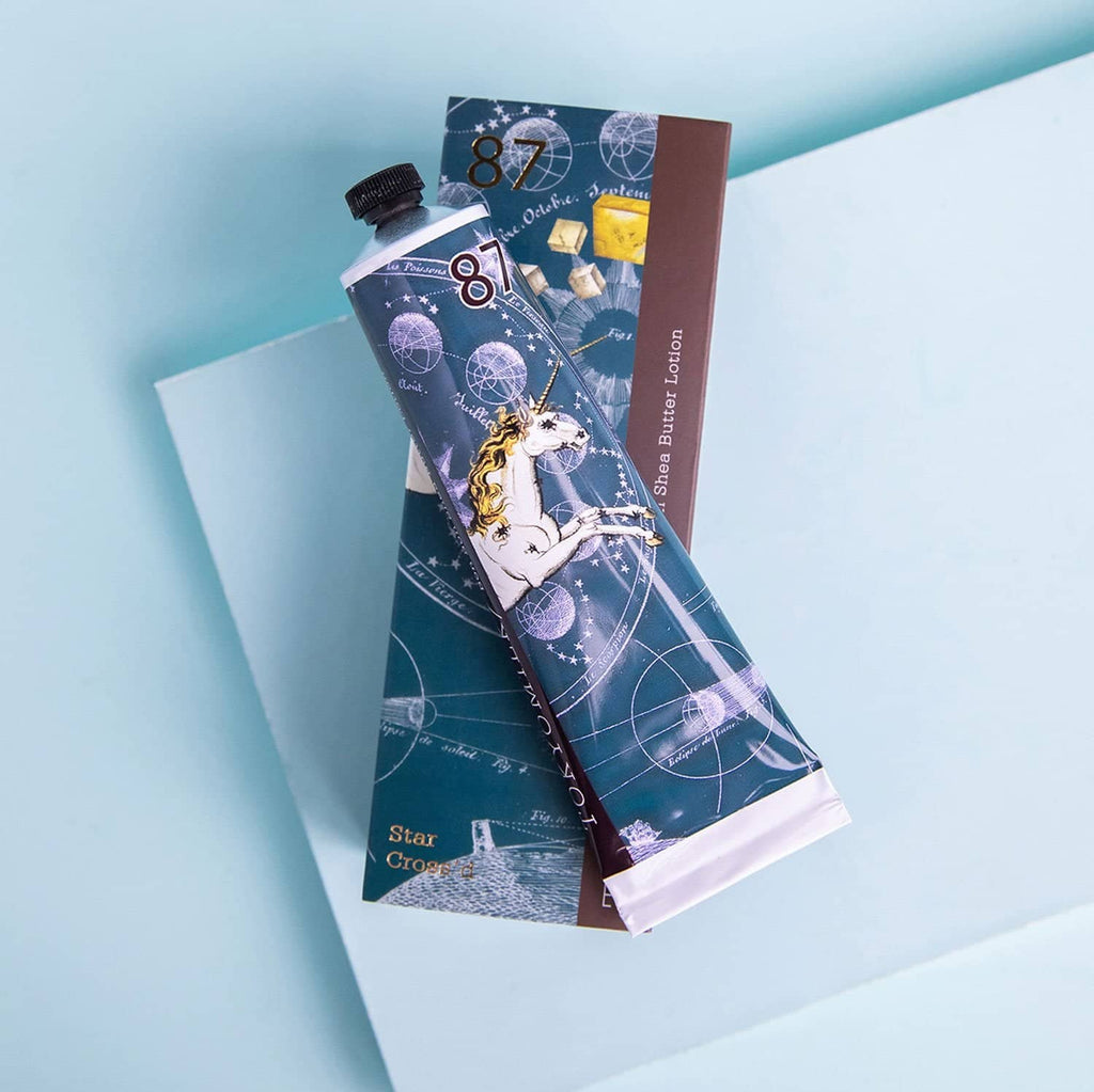 Unicorn-themed tube of toothpaste on a light blue background