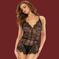 Model wearing an elegant, black lace romper with delicate eyelash lace at the chest and hem.