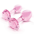Pink glass plugs on a white background with text indicating suitability for all levels.