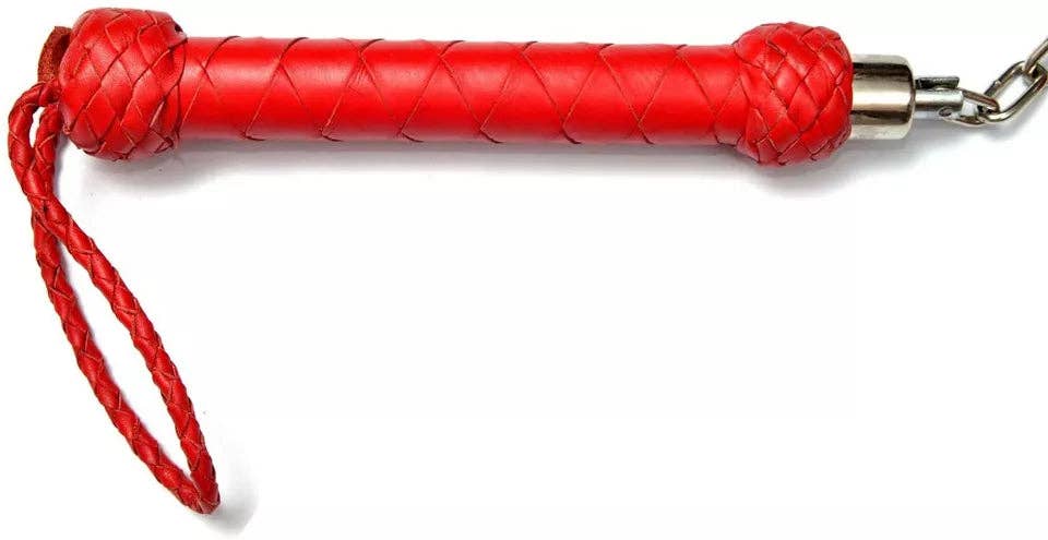 Red leather whip with a braided handle, red wrist strap, and silver metal chain on a white background.