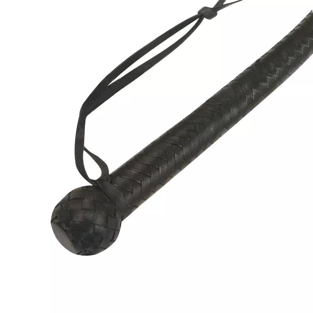 Black leather whip with a textured braided handle, a round ball-shaped tip, and an attached black strap, shown on a plain white background.