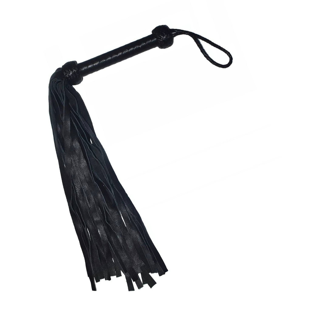 Black leather flogger with a textured handle, a wrist loop, and a long fringe tassel, shown on a plain white background.