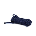 Coiled navy blue rope on a white background