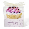 A bath bomb shaped exactly like a sweet cupcake, but with floral herds as decoration.