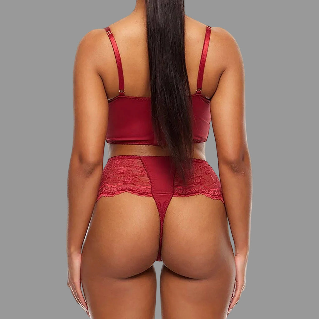 Person wearing a red lingerie set on a white background
