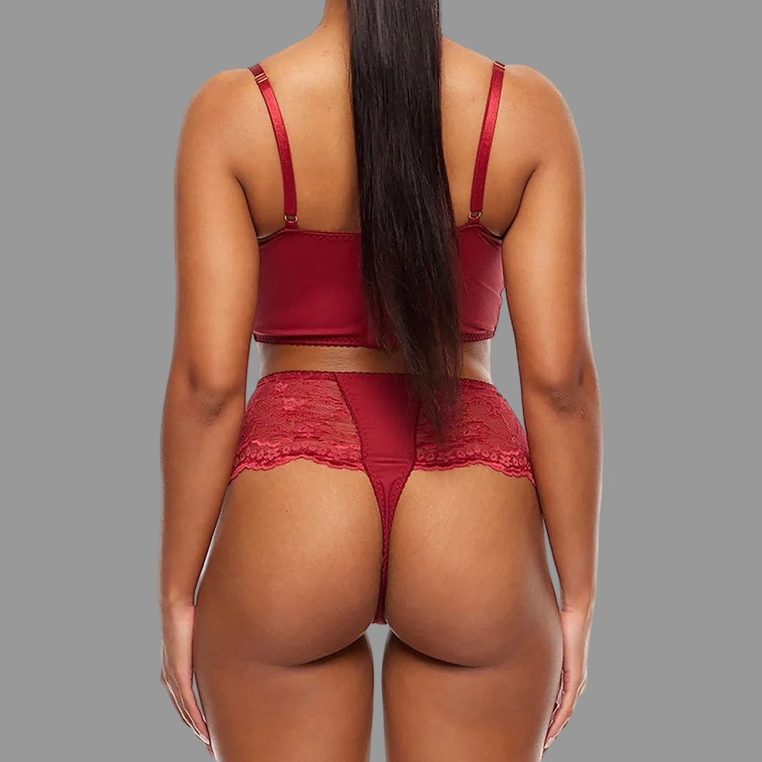 Person wearing a red lingerie set on a white background