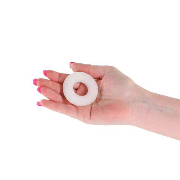 Hand holding a white rubber ring against a white background