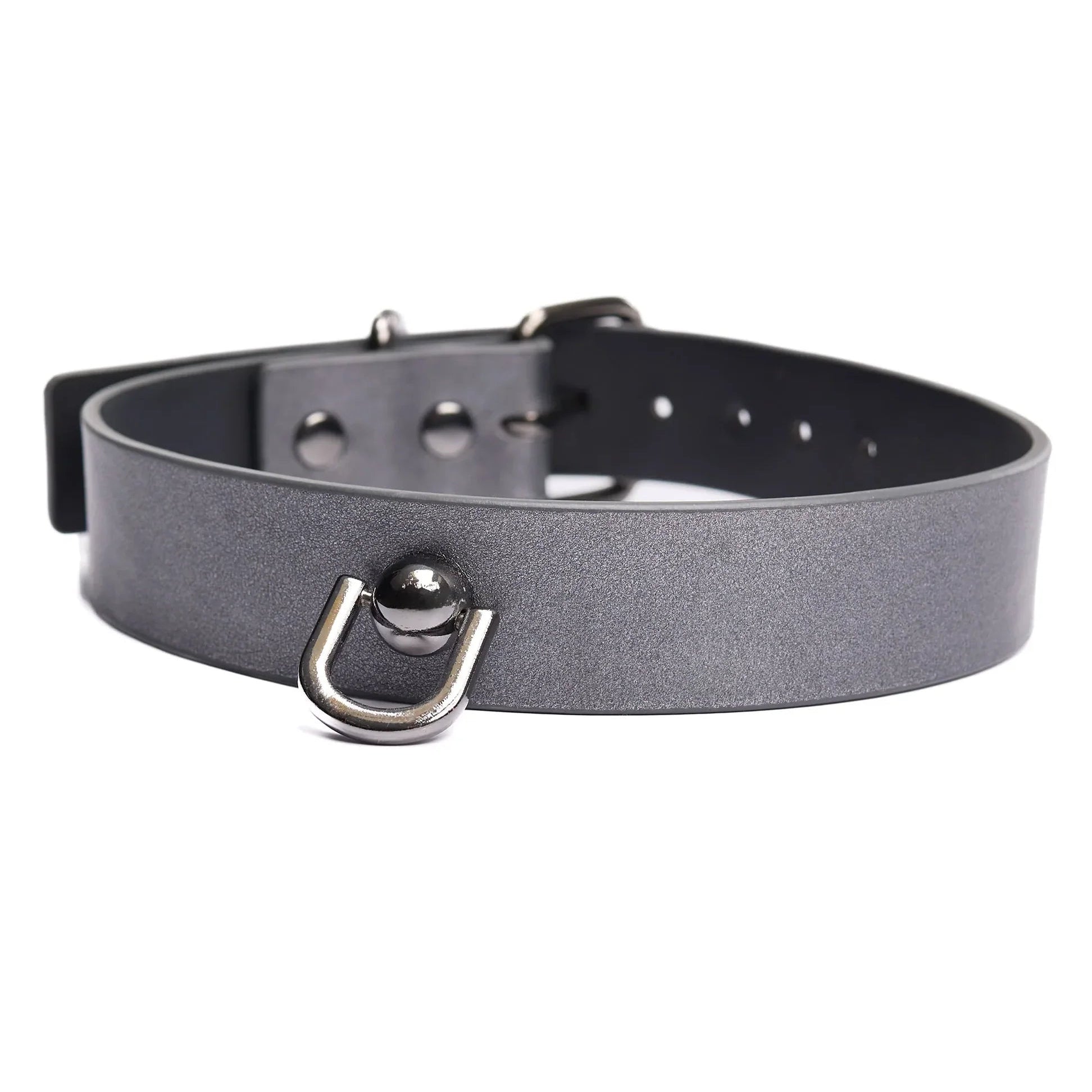 Close up of the collar, showing a unique U-shaped ring a with a round bulb as the rivet holding it to the faux leather collar.