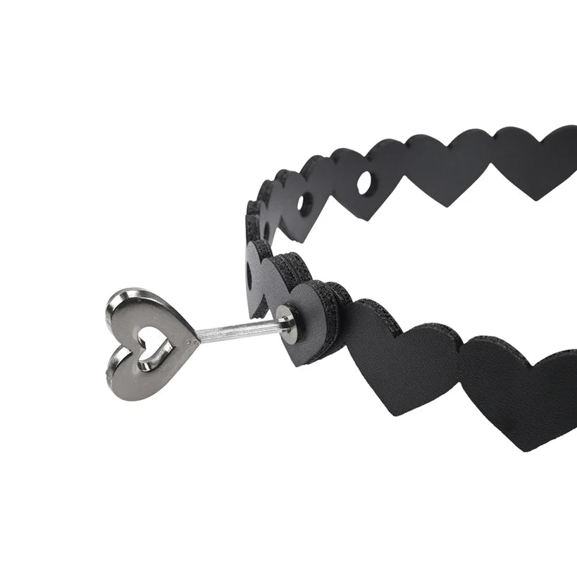 Black heart-shaped collar with a metal clasp on a white background