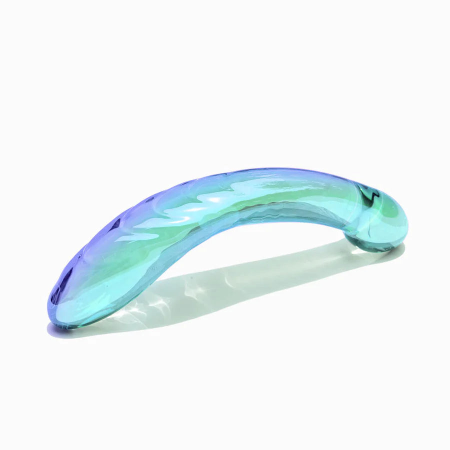 Gradient blue and green hair clip on a white background