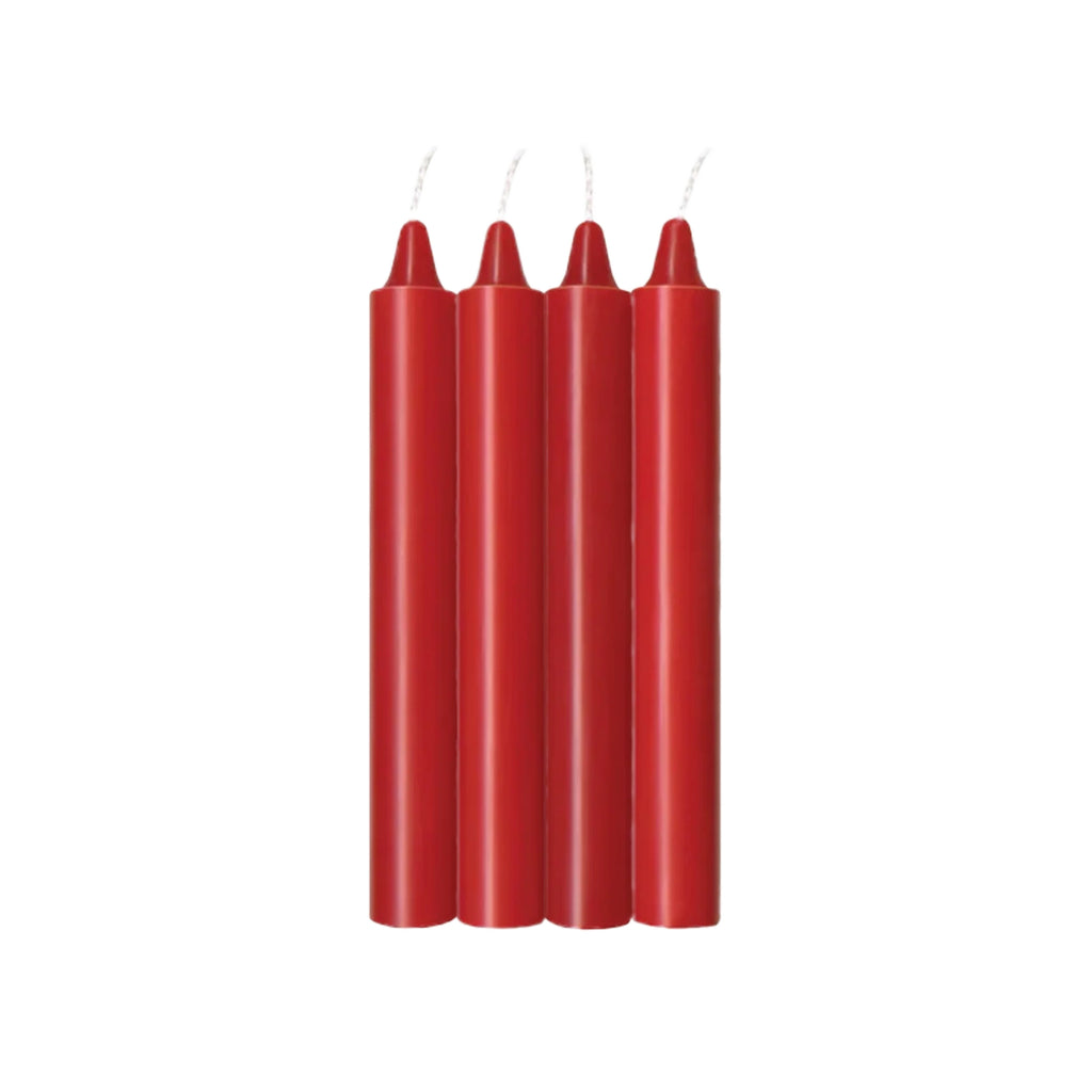 Four red taper candles standing upright side by side on a plain white background.
