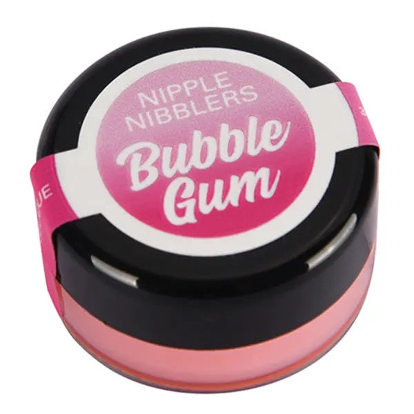 A round container of Nipple Nibblers Bubble Gum lip balm, featuring a black lid with a pink and white label, and a pink translucent balm visible inside.