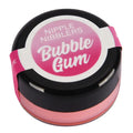 A round container of Nipple Nibblers Bubble Gum lip balm, featuring a black lid with a pink and white label, and a pink translucent balm visible inside.