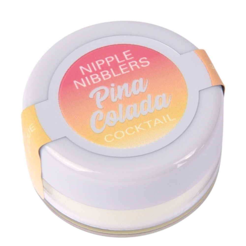 A round white cosmetic container labeled 'NIPPLE NIBBLERS Pina Colada COCKTAIL' on a plain white background.