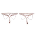 Light peach leg garters with delicate pearl details.