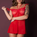 Woman wearing a red lace nightgown against a dark background