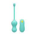 A mint green personal massager with a  matching remote control, both featuring a small yellow power button, shown on a plain white background.