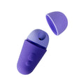 Purple air pulse toy with raised buttons on a dark blue background.
