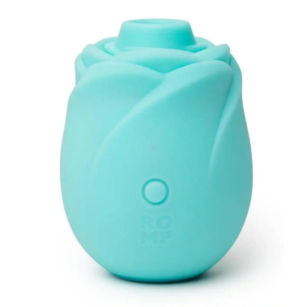 A mint green silicone rose-shaped personal massager with a single button on the front and the brand name 'ROMP' debossed near the base, shown on a clean white background.