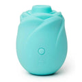 A mint green silicone rose-shaped personal massager with a single button on the front and the brand name 'ROMP' debossed near the base, shown on a clean white background.