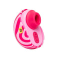 A pink and white striped personal massager with a bright pink silicone sleeve and control buttons, shown against a dark teal background.