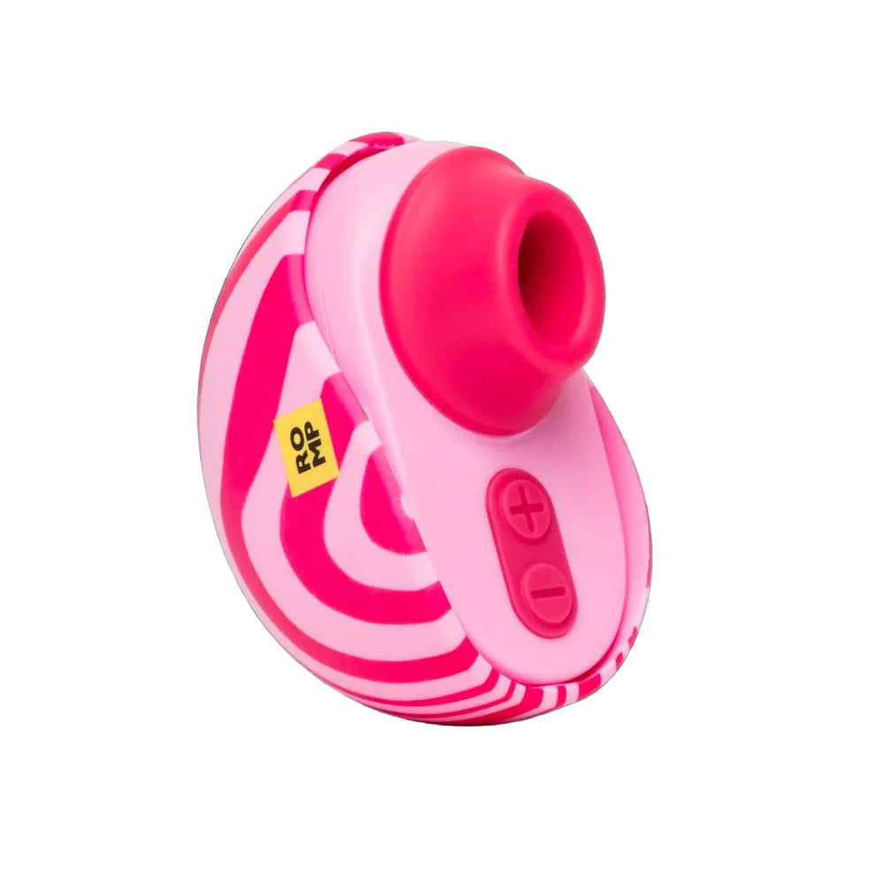 A pink and white striped personal massager with a bright pink silicone sleeve and control buttons, shown against a dark teal background.