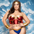 Person wearing a superhero costume with a blue and white abstract background